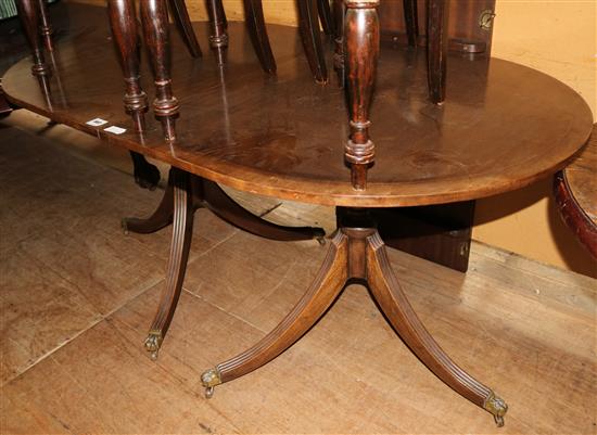 Regency slyle banded mahogany twin pillar dining table(-)